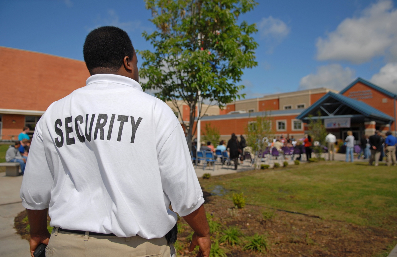 school security guard standing outside patroling