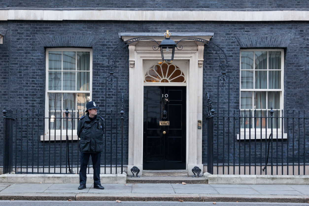 security guard standing outside a home